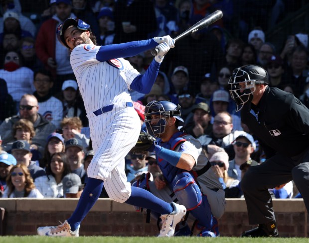 Cubs shortstop Dansby Swanson swings for a strike against the Dodgers in the first inning on April 6, 2024, at Wrigley Field. (John J. Kim/Chicago Tribune)