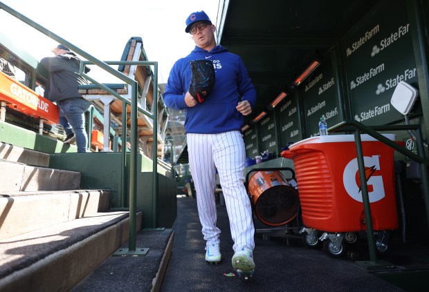 Cubs pitcher Jordan Wicks exits the dugout for the bullpen to warm up before a game against the Dodgers on April 6, 2024, at Wrigley Field. (John J. Kim/Chicago Tribune)