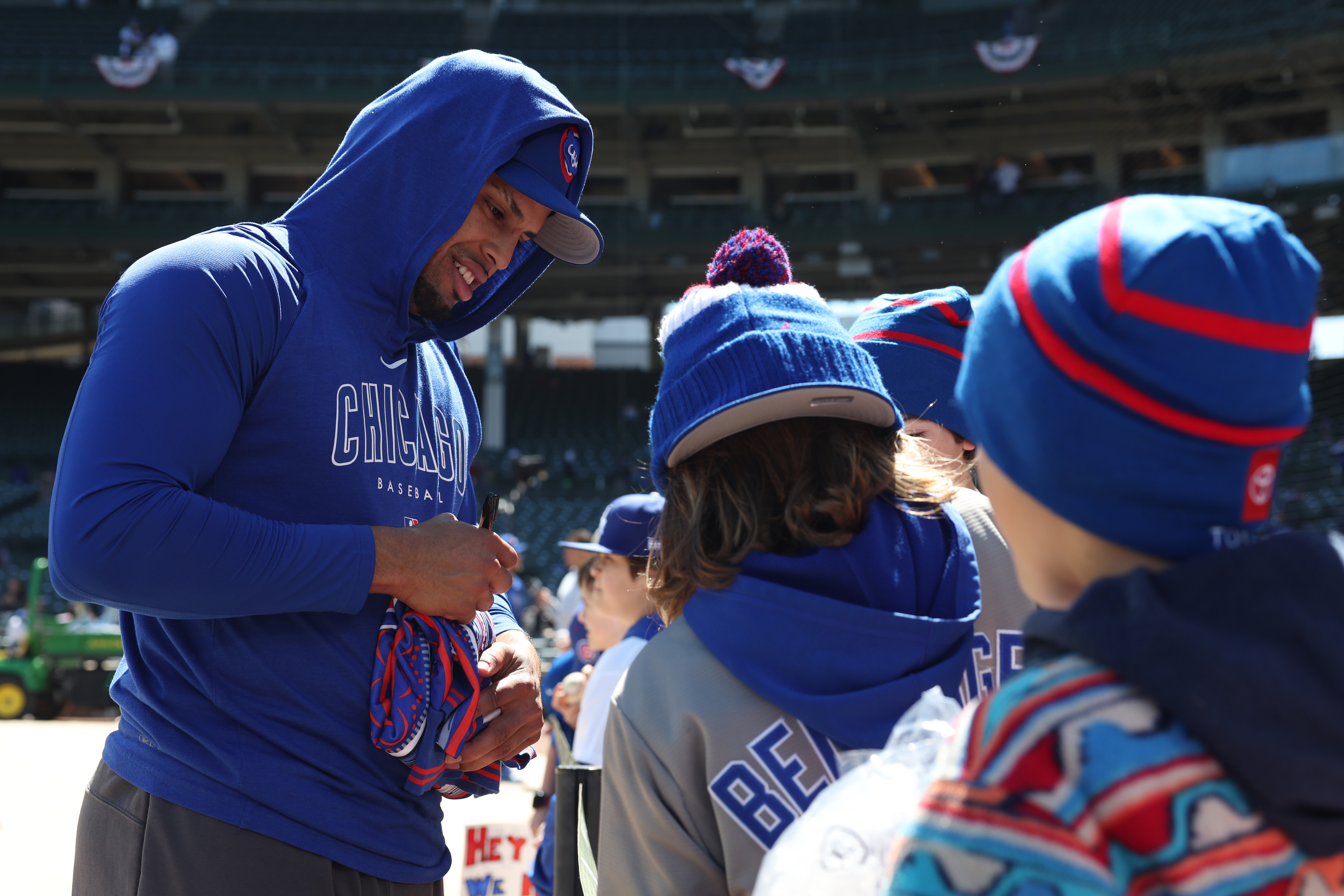 Cubs designated hitter Christopher Morel signs autographs before a game against the Dodgers on April 6, 2024, at Wrigley Field. (John J. Kim/Chicago Tribune)