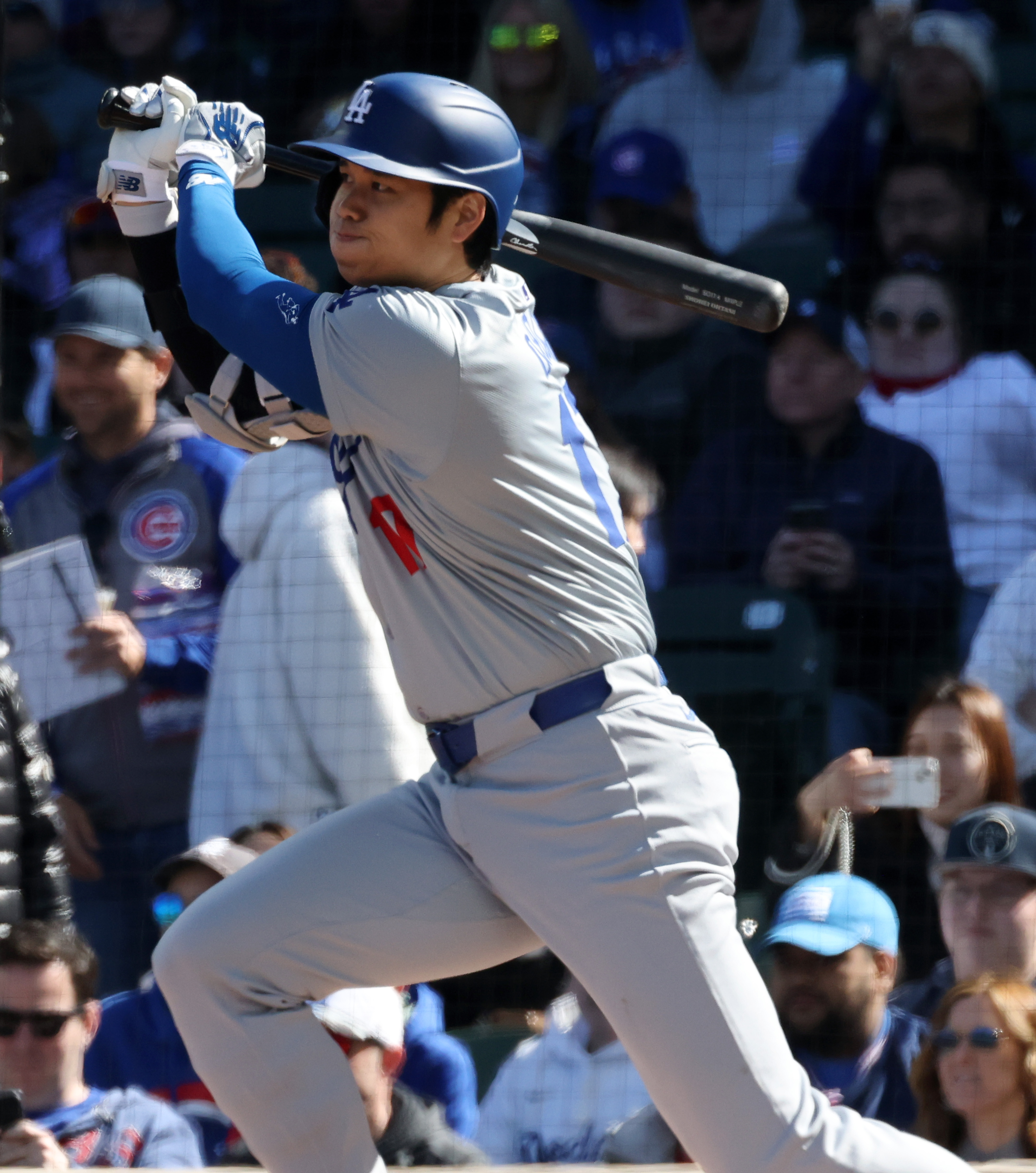 Dodgers designated hitter Shohei Ohtani swings through on a single against the Cubs the first inning at Wrigley Field on April 6, 2024, in Chicago. (John J. Kim/Chicago Tribune)