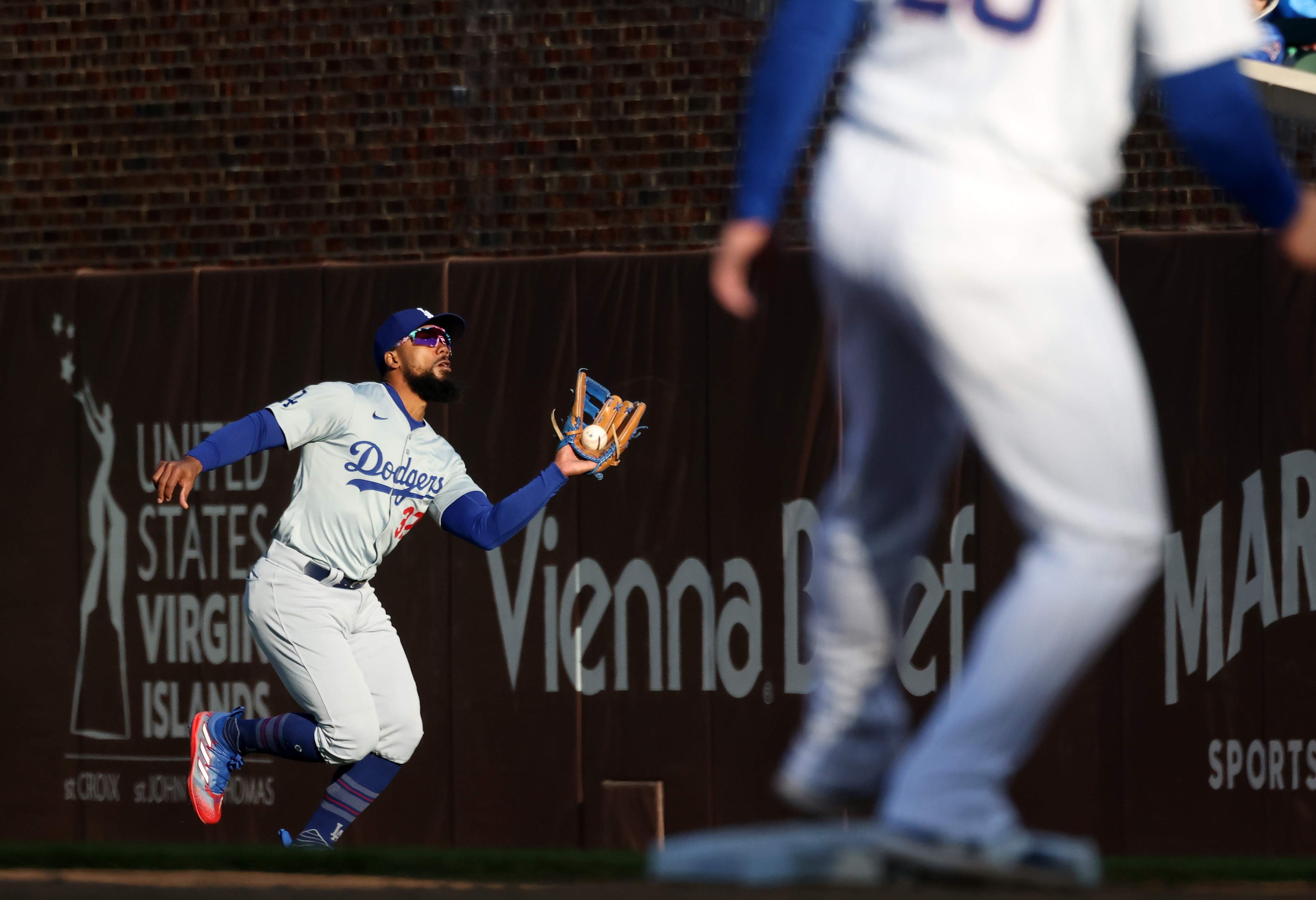Dodgers right fielder Teoscar Hernández (37) catches a fly ball from Cubs second baseman Nico Hoerner (2) for an out in the ninth inning at Wrigley Field on April 6, 2024, in Chicago. (John J. Kim/Chicago Tribune)