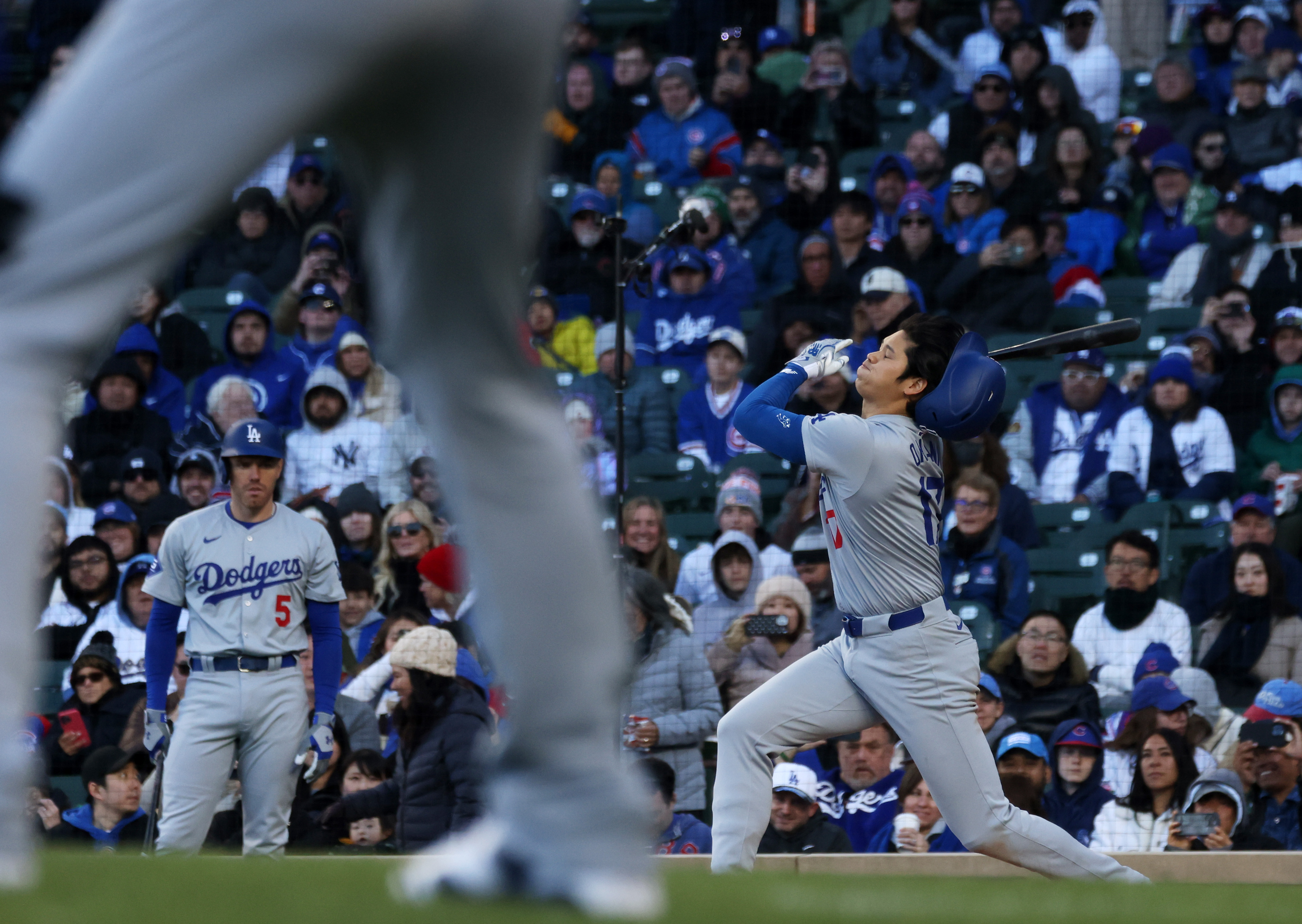 Dodgers designated hitter Shohei Ohtani (17) swings for strike two in the ninth inning against the Cubs at Wrigley Field on April 6, 2024, in Chicago. (John J. Kim/Chicago Tribune)
