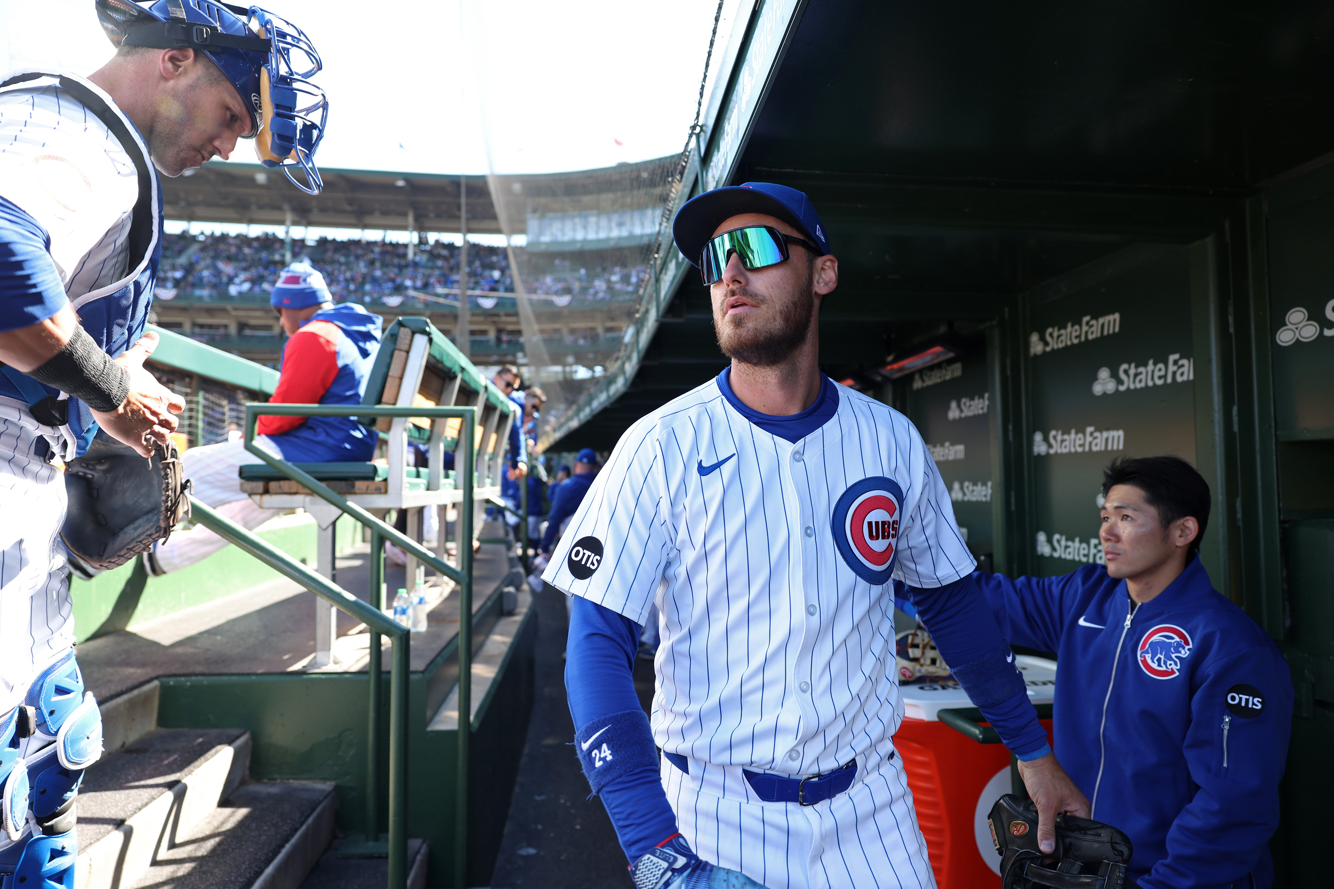 Cubs centerfielder Cody Bellinger, center, walks through the dugout before a game against the Dodgers at Wrigley Field on April 6, 2024, in Chicago. (John J. Kim/Chicago Tribune)
