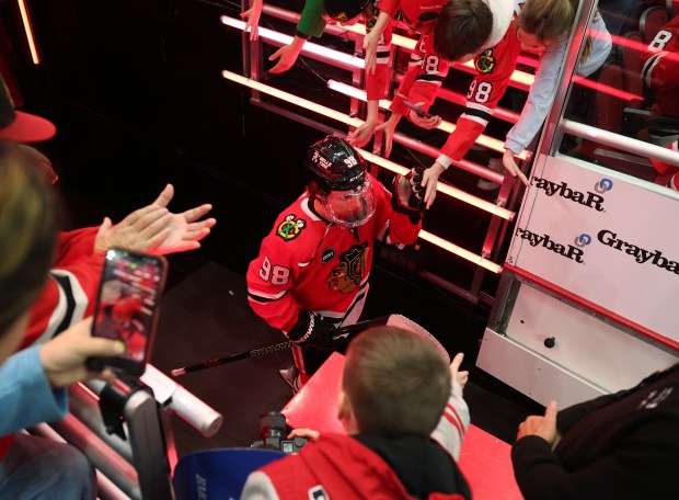 Blackhawks center Connor Bedard (98) heads to the ice for warmups before a game against the Flyers at the United Center on Feb. 21, 2024, in Chicago. (John J. Kim/Chicago Tribune)
