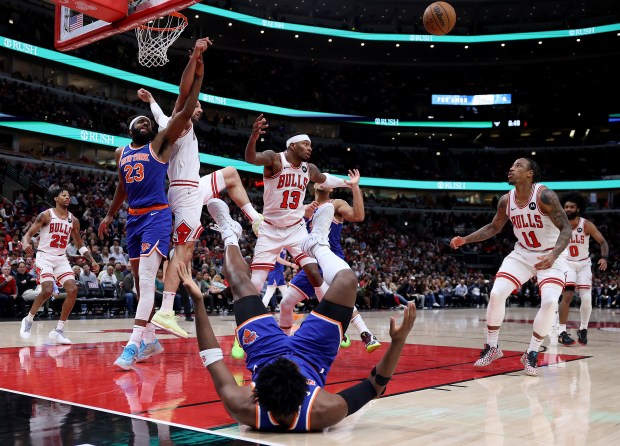 Chicago Bulls forward DeMar DeRozan (right) keeps his eyes on the ball before grabbing a rebound in the second half of a game against the New York Knicks at the United Center in Chicago on April 9, 2024. (Chris Sweda/Chicago Tribune)