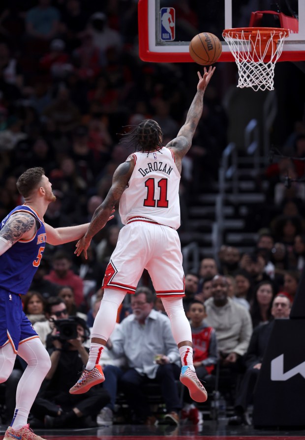 Chicago Bulls forward DeMar DeRozan (11) scores on a layup in the second half of a game against the New York Knicks at the United Center in Chicago on April 9, 2024. (Chris Sweda/Chicago Tribune)