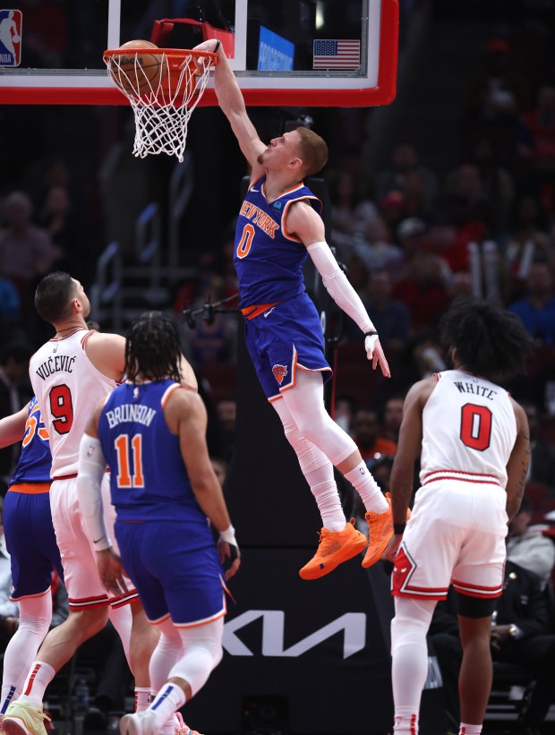 New York Knicks guard Donte DiVincenzo (0) dunks the ball in the first half of a game against the Chicago Bulls at the United Center in Chicago on April 9, 2024. (Chris Sweda/Chicago Tribune)