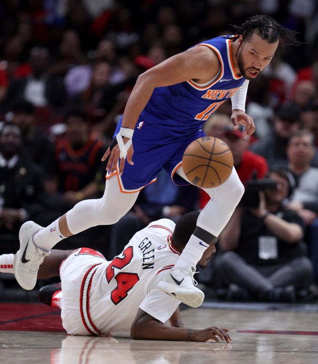 New York Knicks guard Jalen Brunson (11) sprints down the court as Chicago Bulls guard Javonte Green (24) lays on the floor in the second half of a game at the United Center in Chicago on April 9, 2024. (Chris Sweda/Chicago Tribune)
