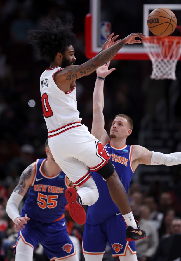 Chicago Bulls guard Coby White (0) passes to a teammate in the second half of a game against the New York Knicks at the United Center in Chicago on April 9, 2024. (Chris Sweda/Chicago Tribune)