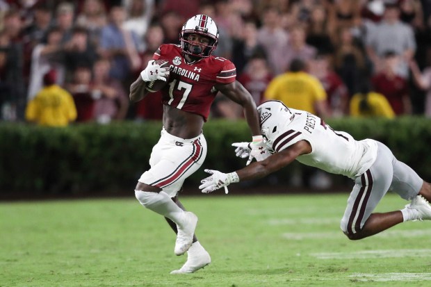 South Carolina wide receiver Xavier Legette runs away from Mississippi State safety Shawn Preston Jr. on Sept. 23, 2023, in Columbia, S.C. (AP Photo/Artie Walker Jr.)