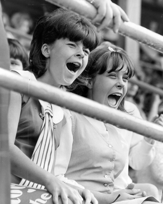 Among the fans in the upper deck were these two screaming Beatle fans at Comiskey Park on Aug. 20, 1965, in Chicago. (Chicago Tribune historical photo) 