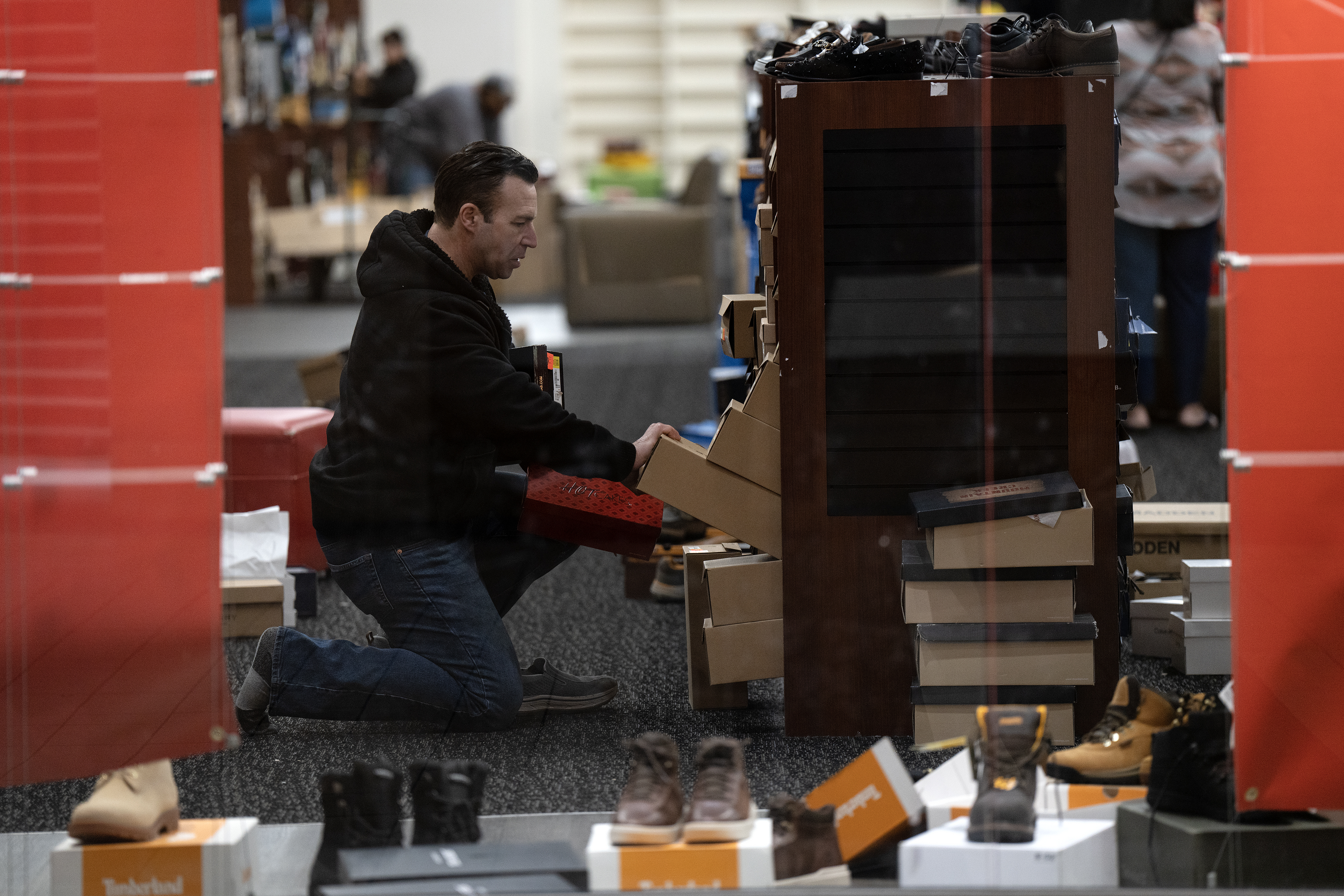 Digging for a last minute bargain in the Spring Hill Mall in West Dundee, which is closing after 43 years. Photographed Wednesday, March 20, 2024. (E. Jason Wambsgans/Chicago Tribune)