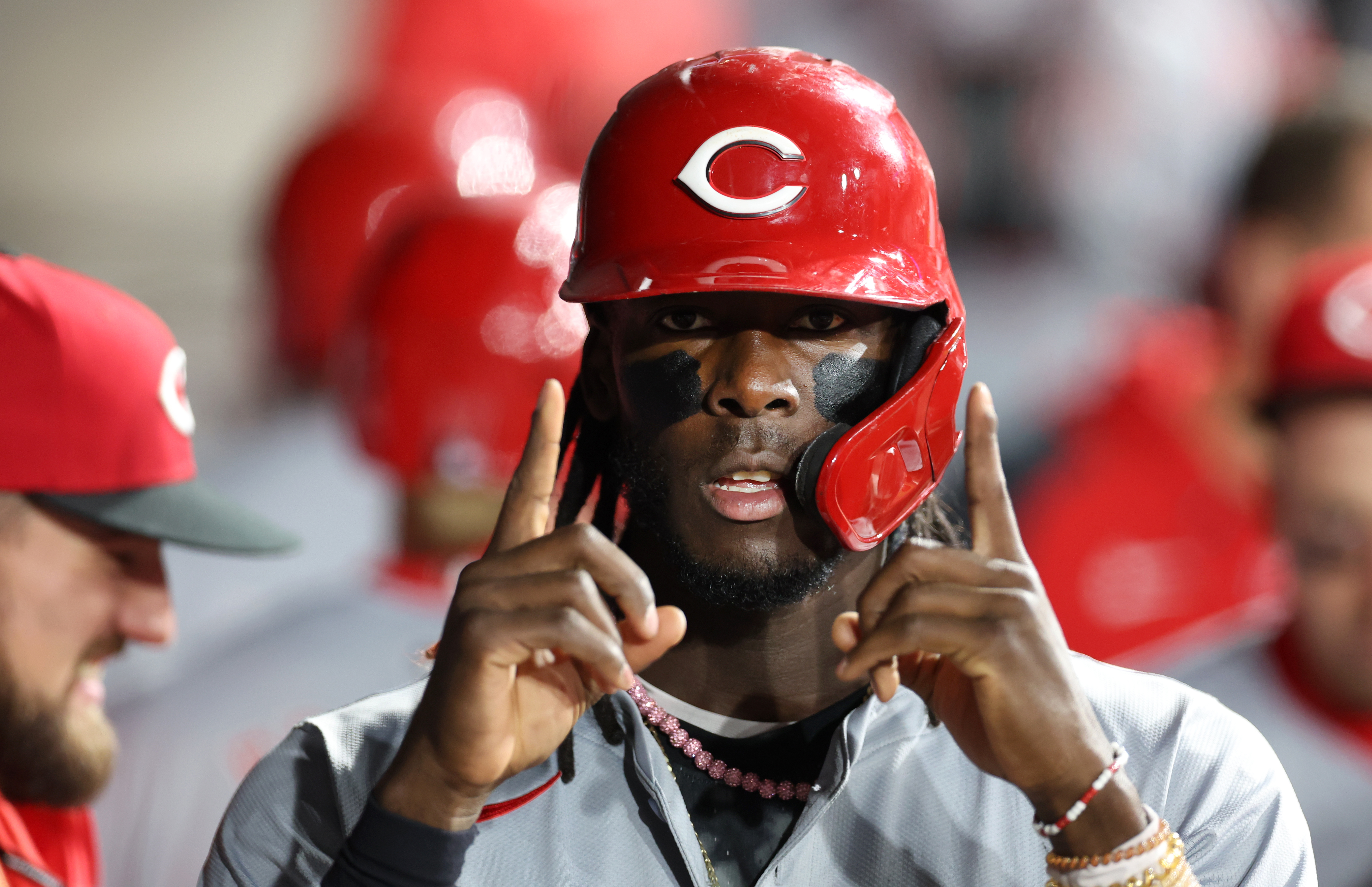 Reds shortstop Elly De La Cruz holds up two fingers after scoring the 11th run on a two-run single from teammate Santiago Espinal in the ninth inning against the White Sox on April 12, 2024, at Guaranteed Rate Field. (Chris Sweda/Chicago Tribune)