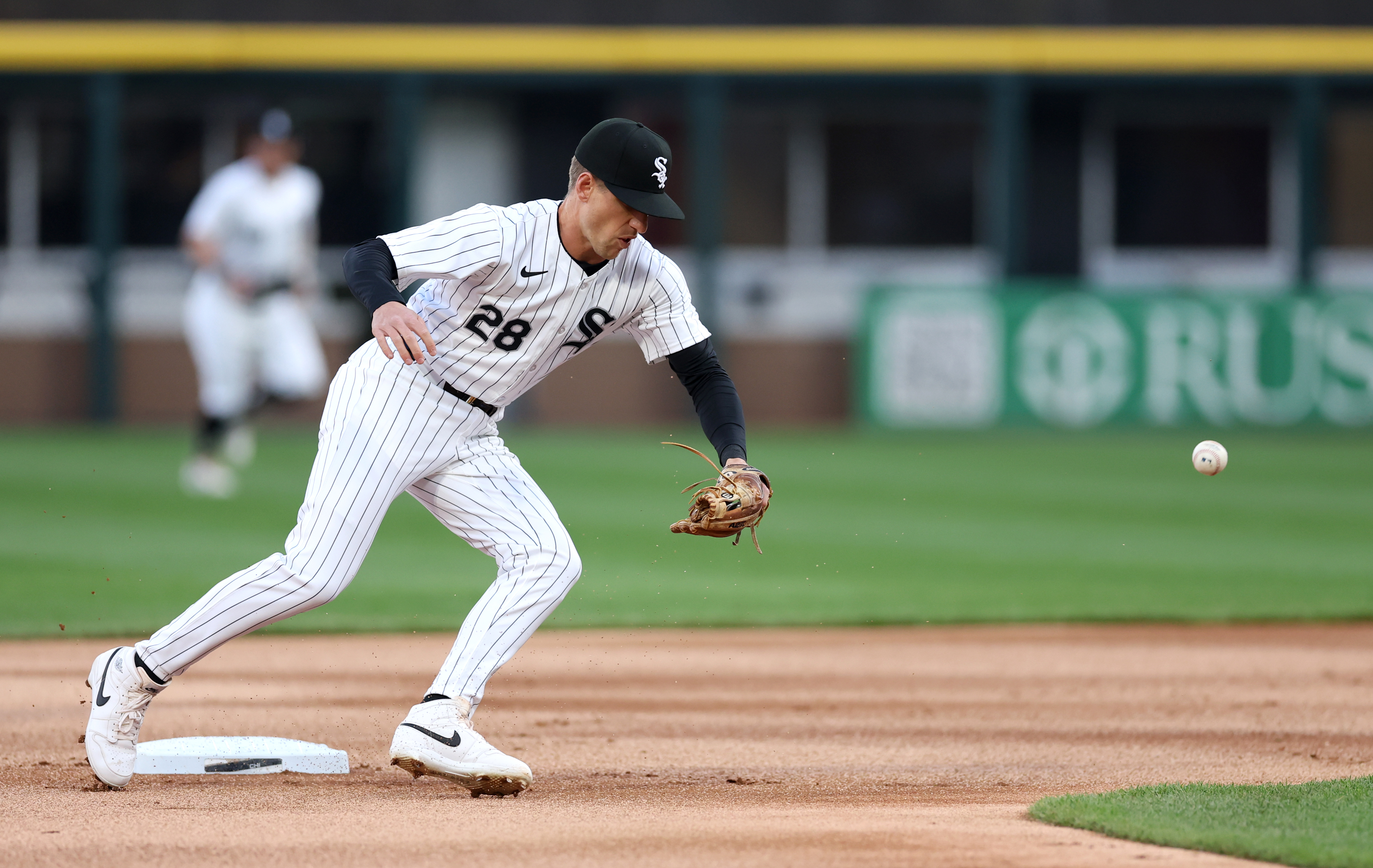 White Sox second baseman Zach Remillard is unable to catch a ball before the Reds' Will Benson arrived at the base with a double in the first inning on April 12, 2024,at Guaranteed Rate Field. (Chris Sweda/Chicago Tribune)