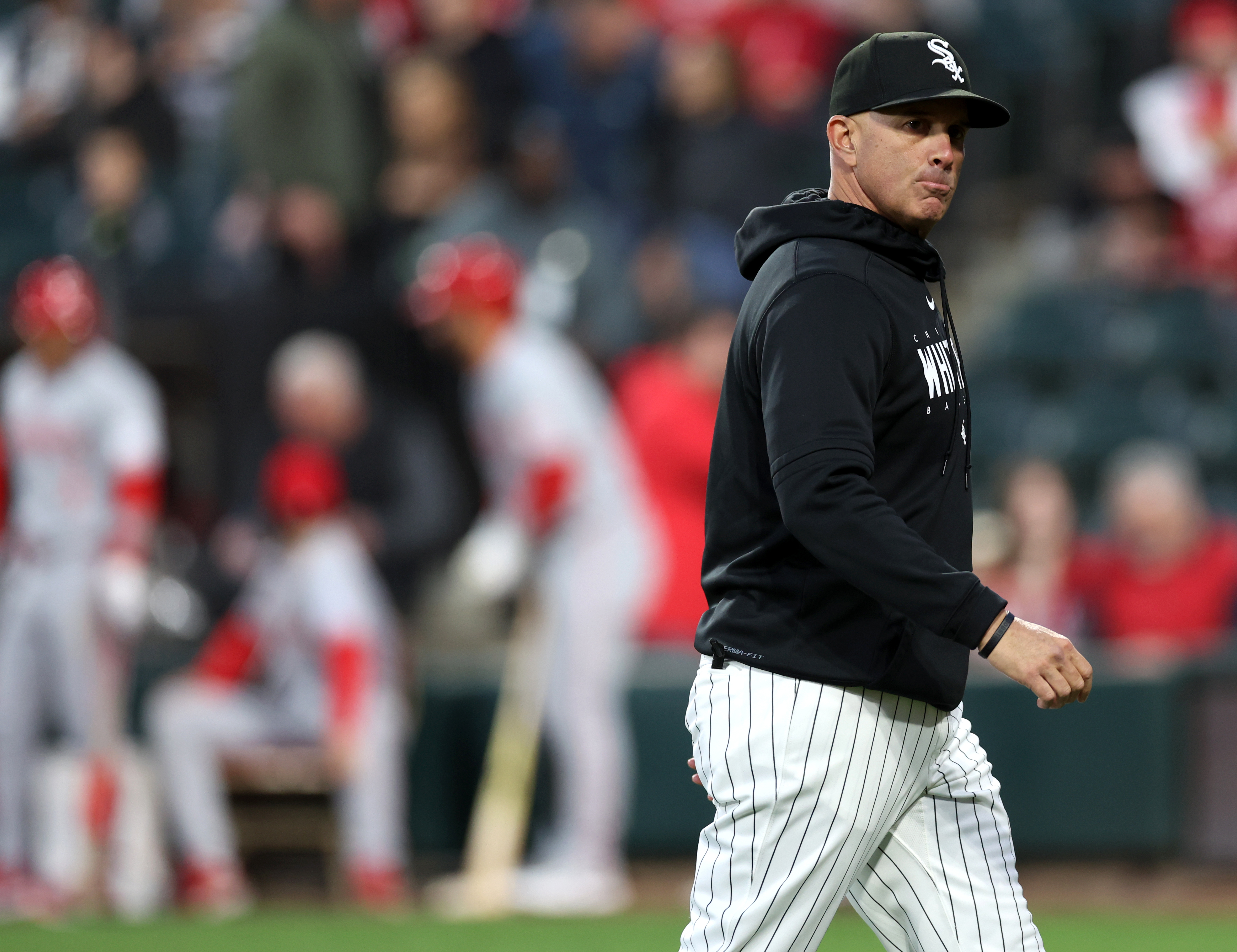 White Sox manager Pedro Grifol walks to the dugout after pulling starting pitcher Chris Flexen from a game against the Reds in the third inning on April 12, 2024, at Guaranteed Rate Field. (Chris Sweda/Chicago Tribune)