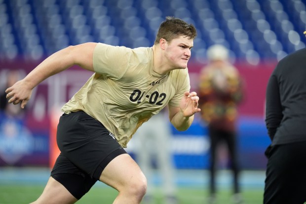 Notre Dame offensive lineman Joe Alt runs a drill at the NFL scouting combine on March 3, 2024, in Indianapolis. (AP Photo/Michael Conroy)