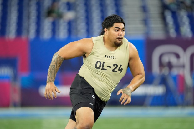 Oregon State offensive lineman Taliese Fuaga runs a drill at the NFL combine on March 3, 2024, in Indianapolis. (AP Photo/Michael Conroy)