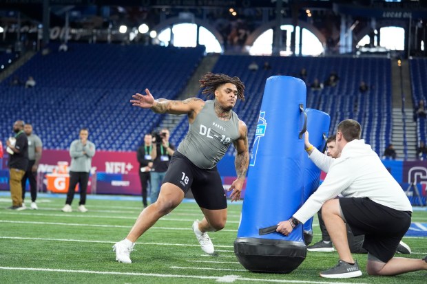Texas defensive lineman Byron Murphy runs a drill at the NFL combine on Feb. 29, 2024, in Indianapolis. (AP Photo/Michael Conroy)