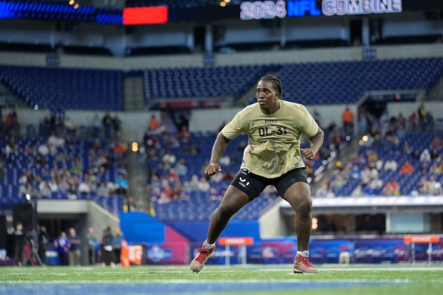 Oklahoma offensive lineman Tyler Guyton runs a drill at the NFL combine on March 3, 2024, in Indianapolis. (AP Photo/Michael Conroy)