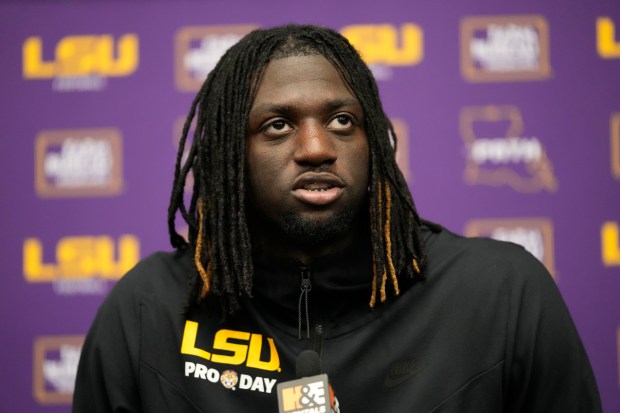 Wide receiver Brian Thomas, Jr. talks to reporters at LSU pro day on March 27, 2024. (AP Photo/Gerald Herbert)