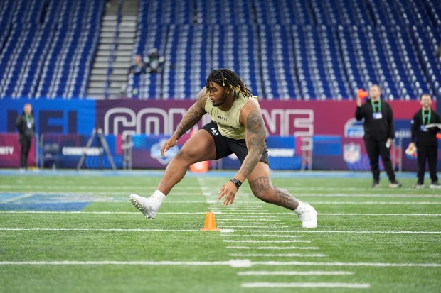 Alabama offensive lineman JC Latham runs a drill at the NFL combine on March 3, 2024, in Indianapolis. (AP Photo/Michael Conroy)