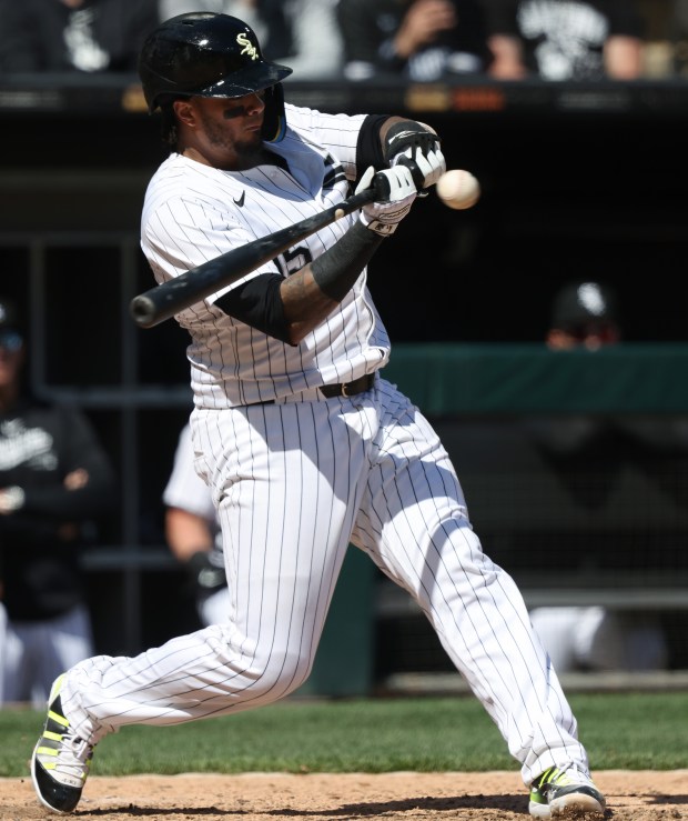 White Sox catcher Martín Maldonado takes a high swing for a strikeout in the fifth inning against the Reds at Guaranteed Rate Field on April 13, 2024, in Chicago. (John J. Kim/Chicago Tribune)