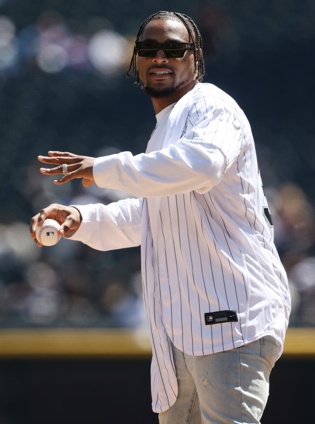 New Chicago Bears safety Jonathan Owens throws out a ceremonial first pitch before a game between the White Sox and Reds at Guaranteed Rate Field on April 13, 2024, in Chicago. (John J. Kim/Chicago Tribune)