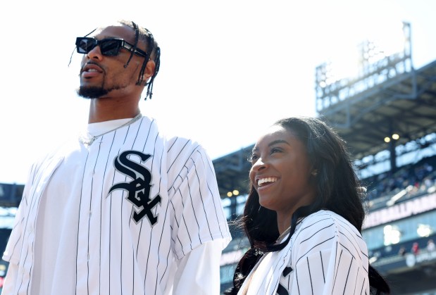 New Chicago Bears safety Jonathan Owens and gymnast Simone Biles attend pregame activities before a game between the White Sox and Reds at Guaranteed Rate Field on April 13, 2024, in Chicago. (John J. Kim/Chicago Tribune)