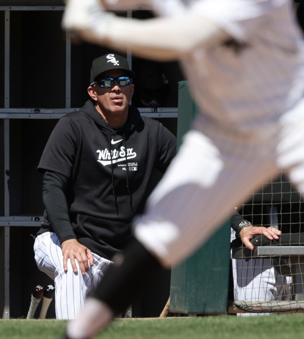 White Sox manager Pedro Grifol watches left fielder Robbie Grossman bat in the third inning against the Reds at Guaranteed Rate Field on April 13, 2024, in Chicago. (John J. Kim/Chicago Tribune)