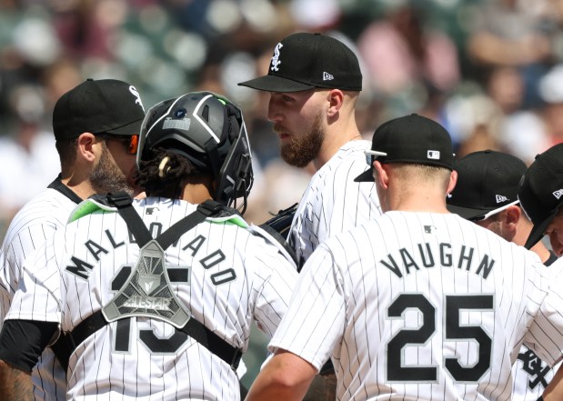 White Sox starting pitcher Garrett Crochet, center, takes a meeting on the mound in the second inning against the Reds at Guaranteed Rate Field on April 13, 2024, in Chicago. (John J. Kim/Chicago Tribune)