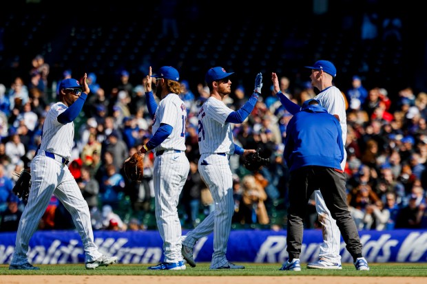 The Cubs celebrate their 8-3 victory against the Marlins on April 19, 2024, at Wrigley Field. (Vincent Alban/Chicago Tribune)