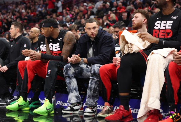 Bulls guard Zach LaVine, center, attends the game against the Knicks in the first quarter on April 5, 2024, at the United Center. (John J. Kim/Chicago Tribune)