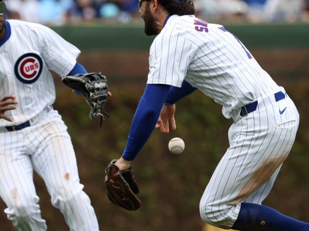 Cubs shortstop Dansby Swanson (7) chases a ball hit by Marlins left fielder Nick Gordon for a double in the sixth inning at Wrigley Field on April 20, 2024, in Chicago. (John J. Kim/Chicago Tribune)