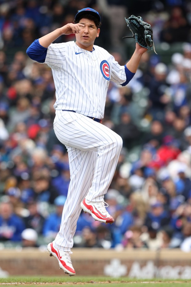 Cubs starting pitcher Javier Assad jumps over the foul line as he is taken out of the game in the fifth inning against the Marlins at Wrigley Field on April 20, 2024, in Chicago. (John J. Kim/Chicago Tribune)