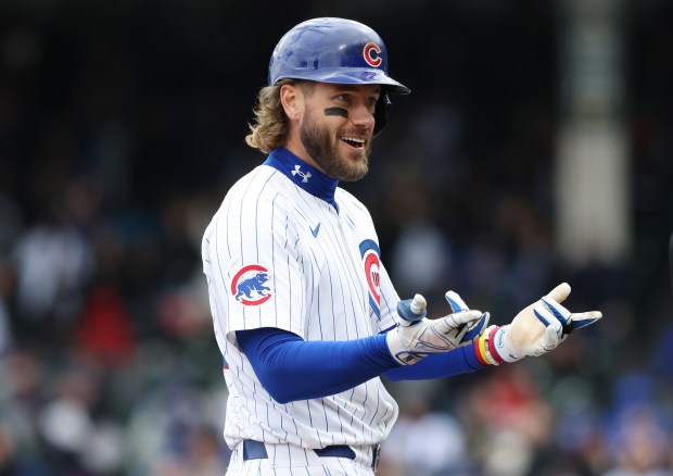Cubs right fielder Patrick Wisdom gestures to teammates after hitting a two-run triple against the Marlins in the third inning at Wrigley Field on April 20, 2024, in Chicago. (John J. Kim/Chicago Tribune)