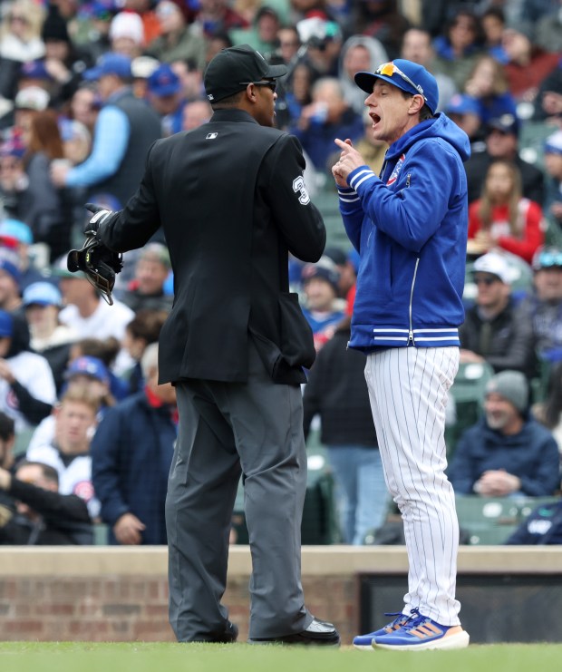 Cubs manager Craig Counsell argues an out call with plate umpire Edwin Moscoso in the fourth inning against the Marlins on April 20, 2024, at Wrigley Field. (John J. Kim/Chicago Tribune)