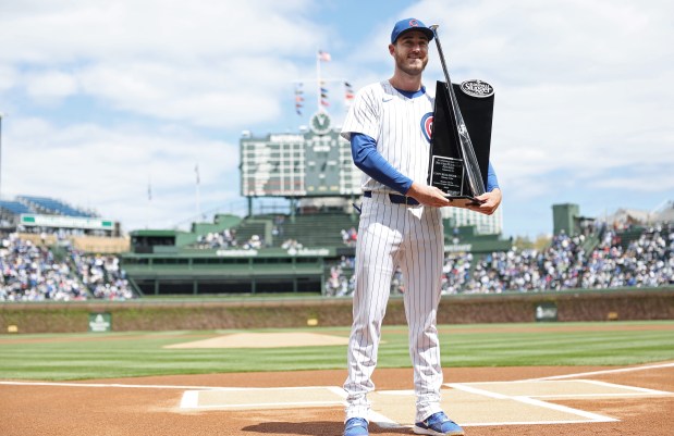 Cubs outfielder Cody Bellinger stands for pictures after receiving a Silver Slugger award before a game against the Marlins at Wrigley Field on April 20, 2024, in Chicago. (John J. Kim/Chicago Tribune)