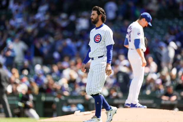 Chicago Cubs shortstop Dansby Swanson (7) walks into the infield after striking out during the first inning against the Miami Marlins at Wrigley Field on April 21, 2024. (Eileen T. Meslar/Chicago Tribune)