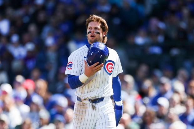 Chicago Cubs second base Nico Hoerner (2) walks to the dugout after being tagged out at home plate during the fourth inning against the Miami Marlins at Wrigley Field on April 21, 2024. (Eileen T. Meslar/Chicago Tribune)