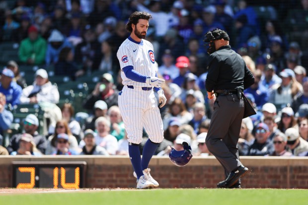 Chicago Cubs shortstop Dansby Swanson (7) throws his helmet on the field after striking out during the first inning against the Miami Marlins at Wrigley Field on April 21, 2024. (Eileen T. Meslar/Chicago Tribune)