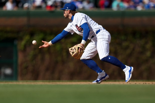 Chicago Cubs second base Nico Hoerner (2) throws the ball to second base after fielding the ball during the ninth inning against the Miami Marlins at Wrigley Field on April 21, 2024. (Eileen T. Meslar/Chicago Tribune)