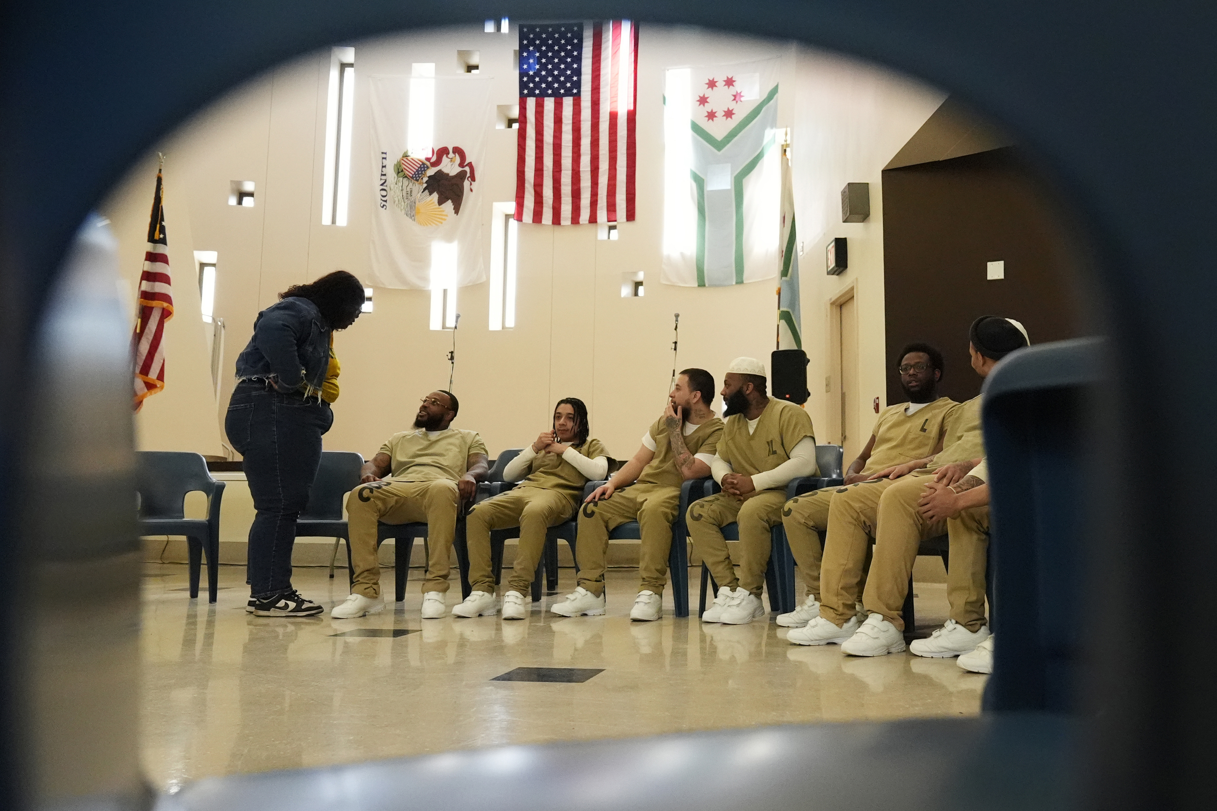 DePaul student Nana Ampoto, left, talks with detainees during a...