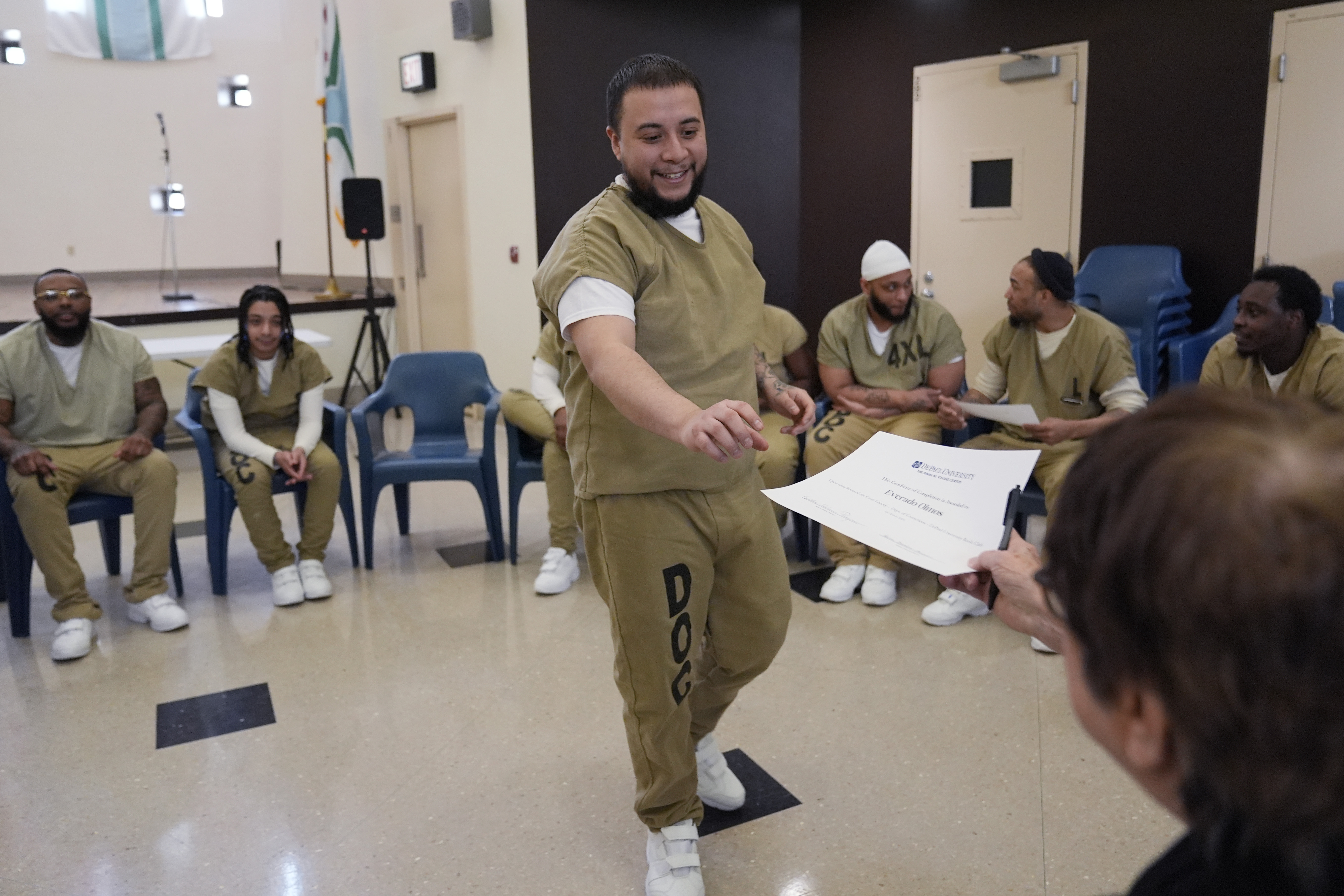 Everado Olmos, detainee in Division Of Correction 11, receives a...