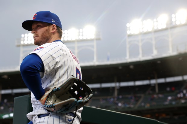 Chicago Cubs outfielder Ian Happ (8) waits to take the field for a game against the Houston Astros at Wrigley Field in Chicago on April 23, 2024. (Chris Sweda/Chicago Tribune)