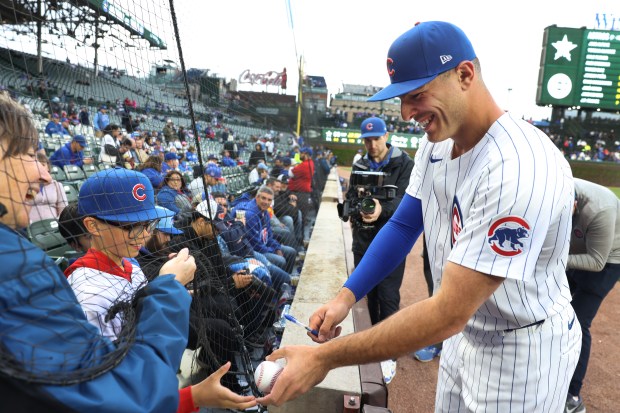 Chicago Cubs designated hitter Matt Mervis signs autographs for fans before a game against the Houston Astros at Wrigley Field in Chicago on April 23, 2024. (Chris Sweda/Chicago Tribune)