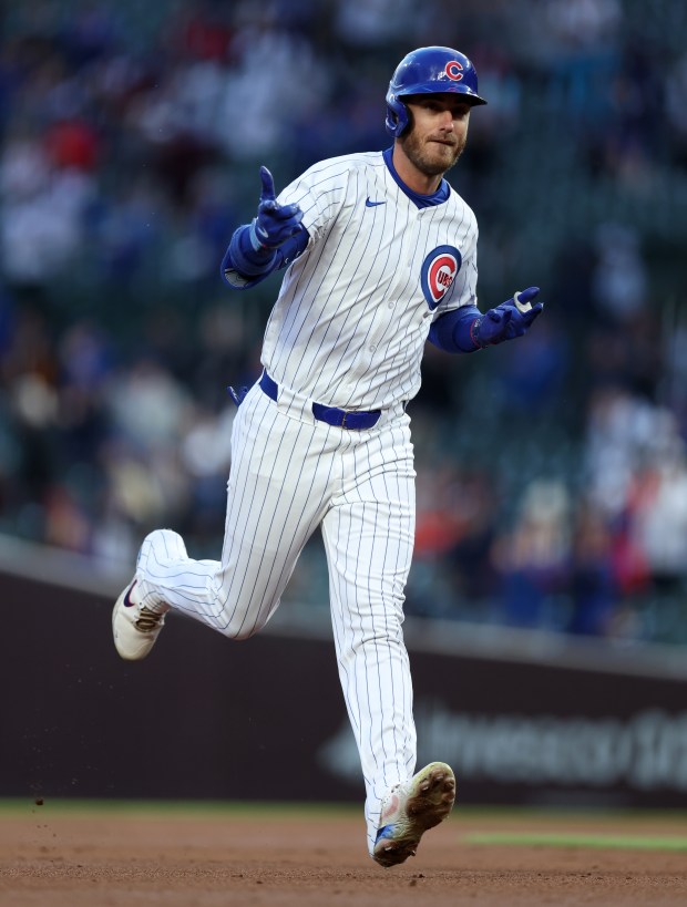 Chicago Cubs centerfielder Cody Bellinger celebrates as he rounds the bases after hitting a 2-run home run in the first inning of a game against the Houston Astros at Wrigley Field in Chicago on April 23, 2024. (Chris Sweda/Chicago Tribune)