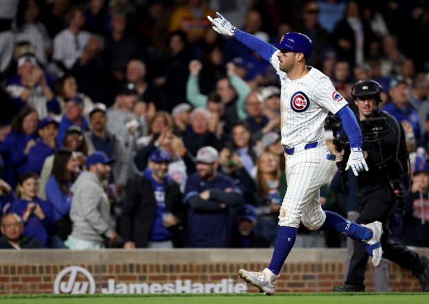 Chicago Cubs outfielder Mike Tauchman (40) celebrates as he rounds the bases after hitting a solo home run in the 8th inning of a game against the Houston Astros at Wrigley Field in Chicago on April 23, 2024. (Chris Sweda/Chicago Tribune)
