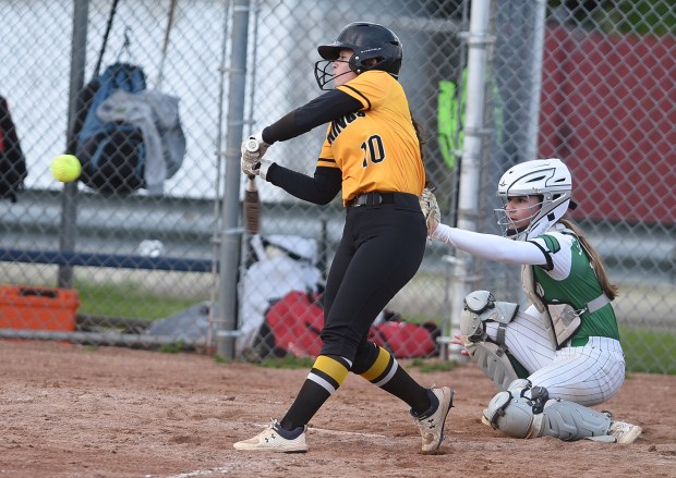 St. Laurence's Breanna Cahue (10) connects for a double against Providence during a Girls Catholic Athletic Conference game Tuesday, April 23, 2024 in Burbank, IL. (Steve Johnston/Daily Southtown)