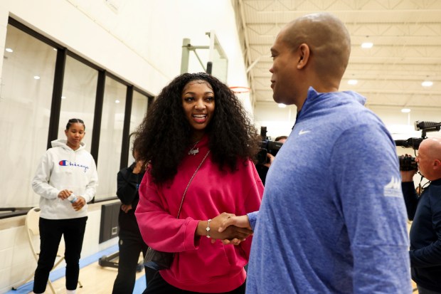 Newly drafted Chicago Sky player Angel Reese speaks to Assistant Coach Sydney Johnson after answering media questions at Sachs Recreation Center in Deerfield on April 24, 2024. (Eileen T. Meslar/Chicago Tribune)