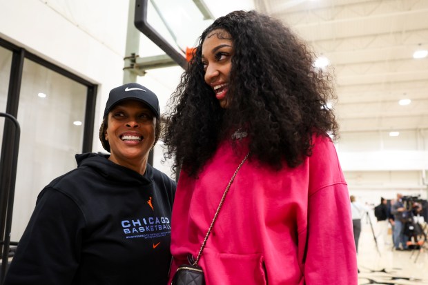 Newly drafted Chicago Sky player Angel Reese speaks to Head Coach Teresa Weatherspoon after answering media questions at Sachs Recreation Center in Deerfield on April 24, 2024. (Eileen T. Meslar/Chicago Tribune)